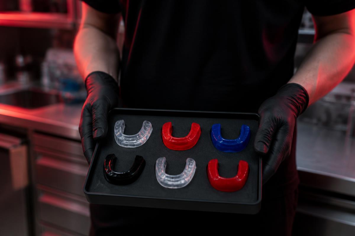 Custom mouthguards from a mouthguards company in California displayed on a lab tray